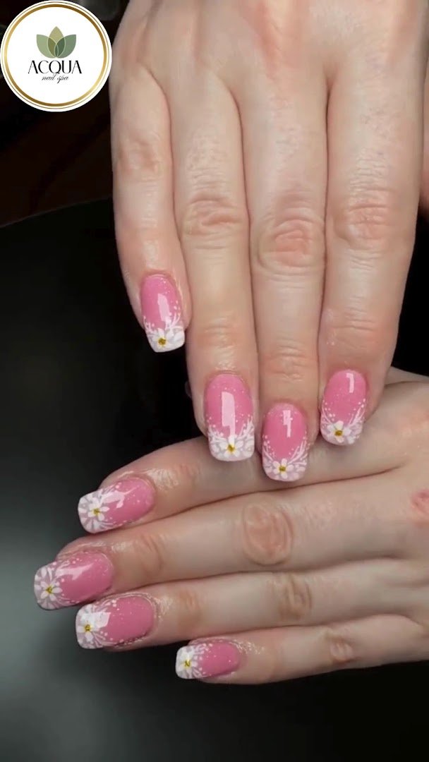 Acrylic nails and nail art on display.